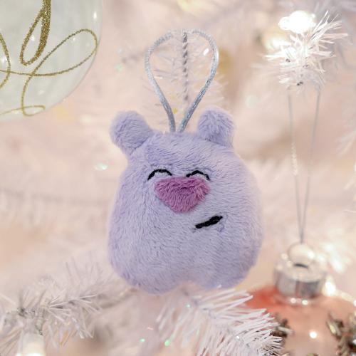 light purple christmas ornament bear with a pink nose with a white christmas tree on the back