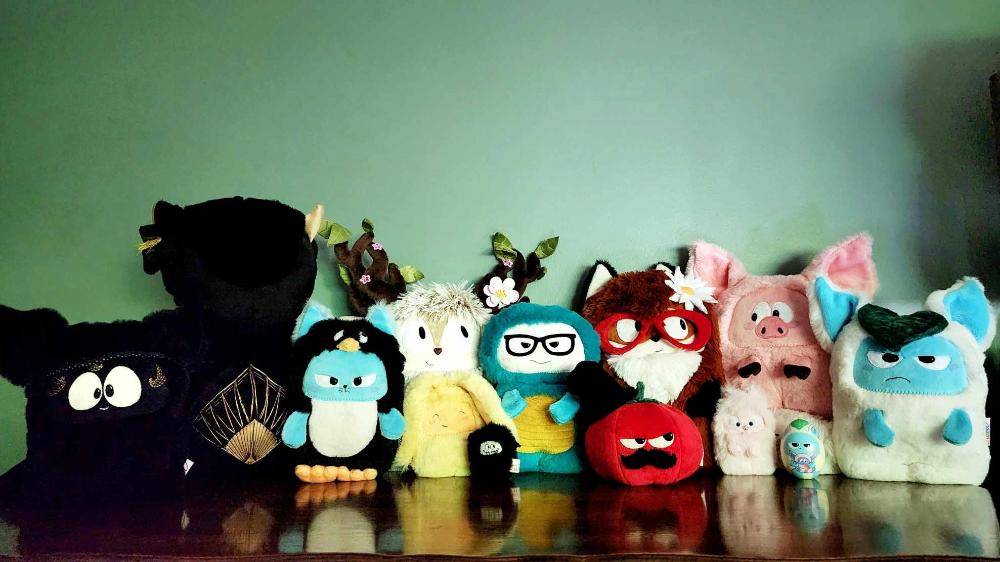 Line up of 12 collectible plushies by Petit loulou